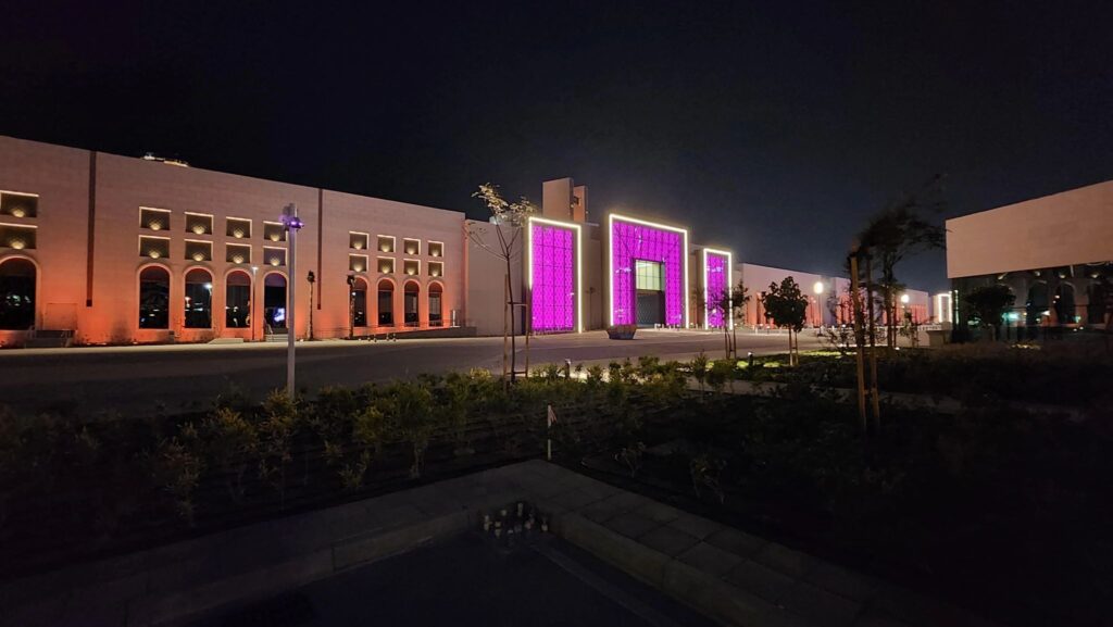 Commercial facade lighting in Bahrain illuminating modern office tower at night