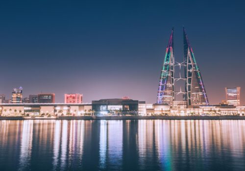 Facade lighting in Bahrain highlighting Manama skyline and waterfront buildings at night