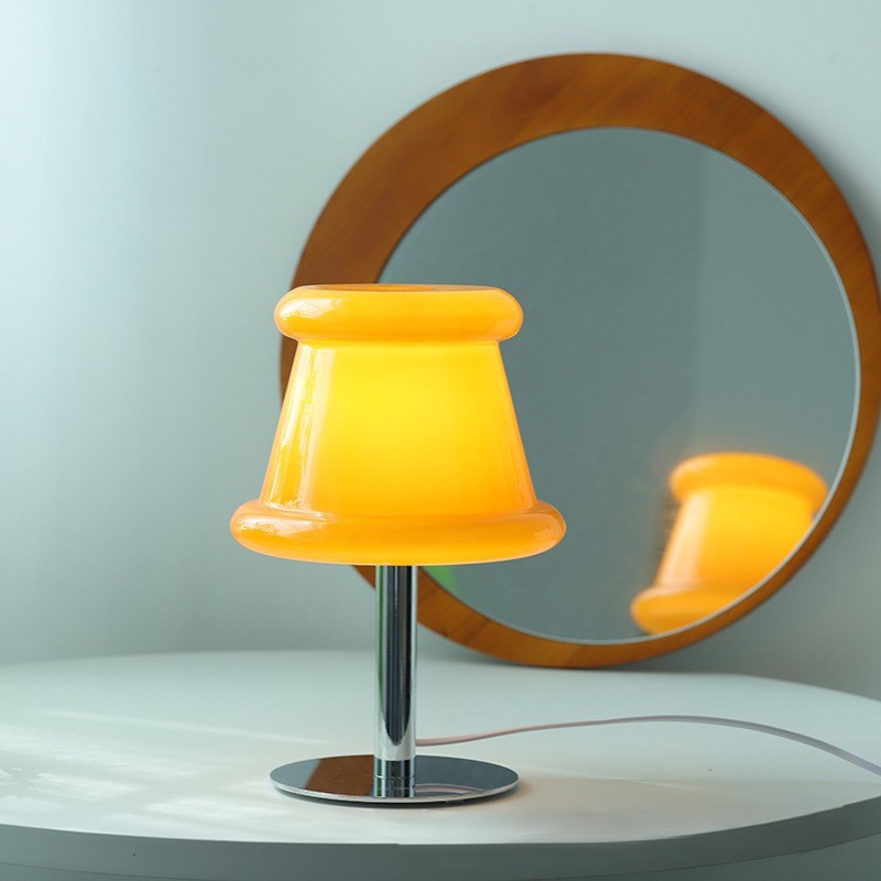 portable lamp creating warm ambient lighting in a cozy bedroom